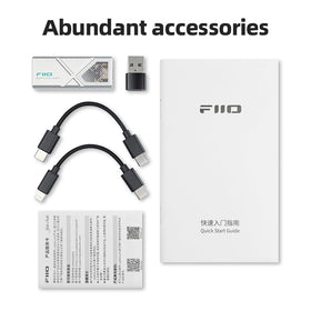 FiiO KA13 beside a credit card showing compact pocketable size and travel convenience
