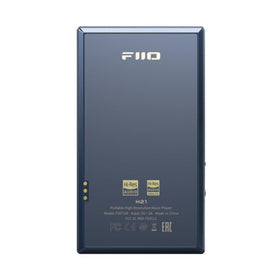 FiiO M21 balanced 4.4mm output jack close-up on premium headphones