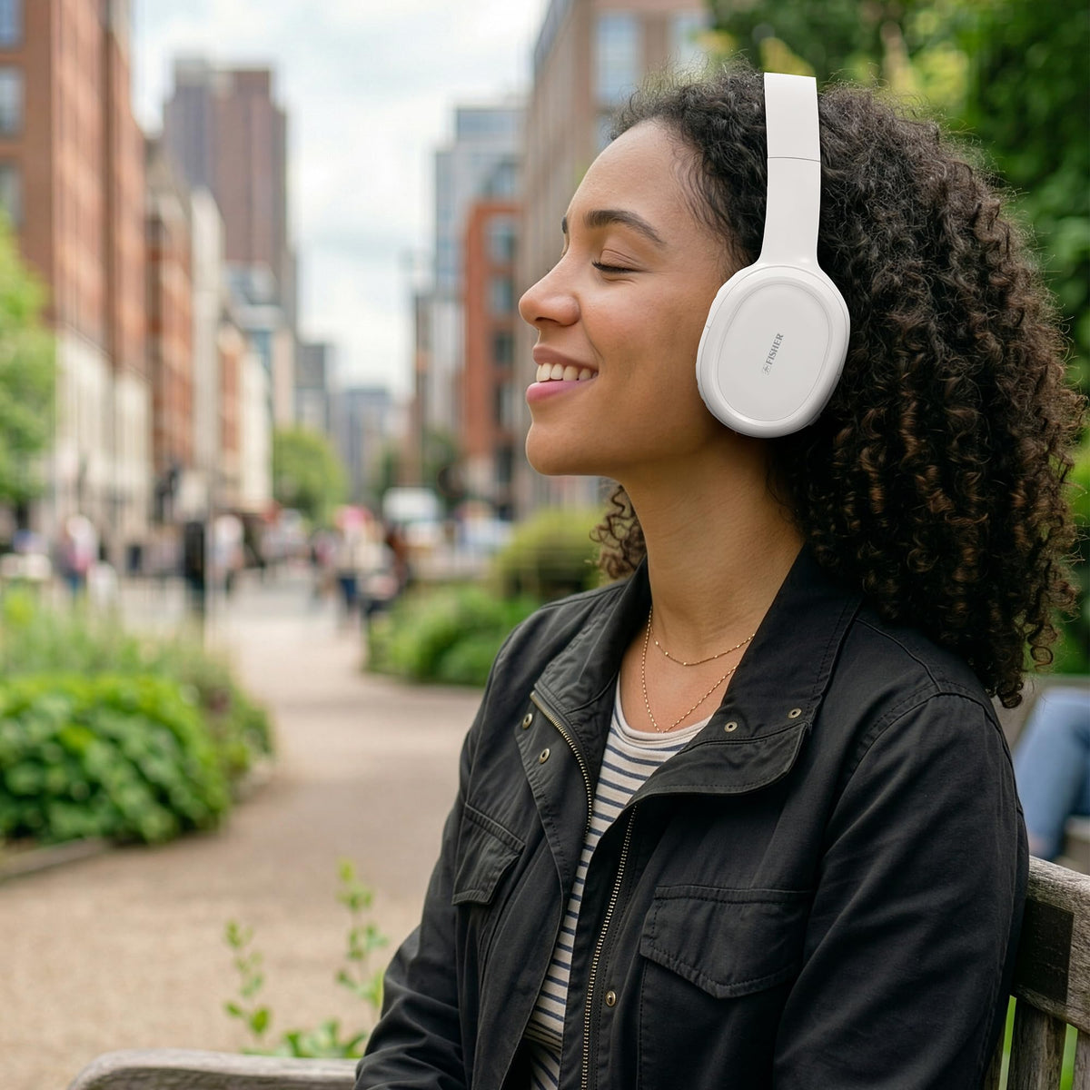 Fisher ANC headphones in a travel setup for commutes and planes