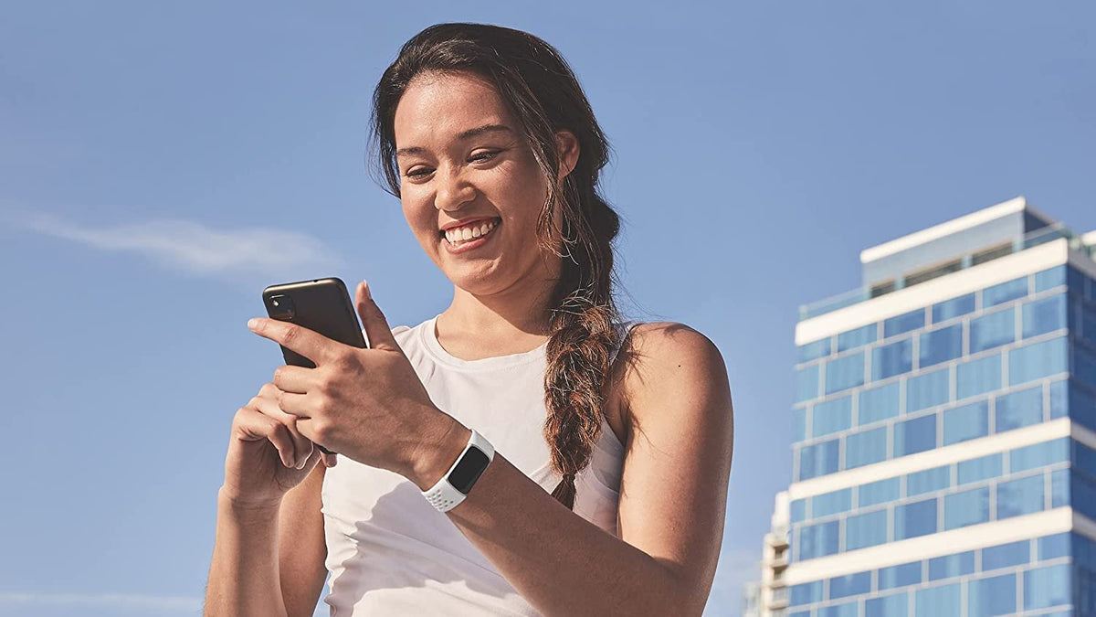 Fitbit frost white large perforations detail for breathability benefit