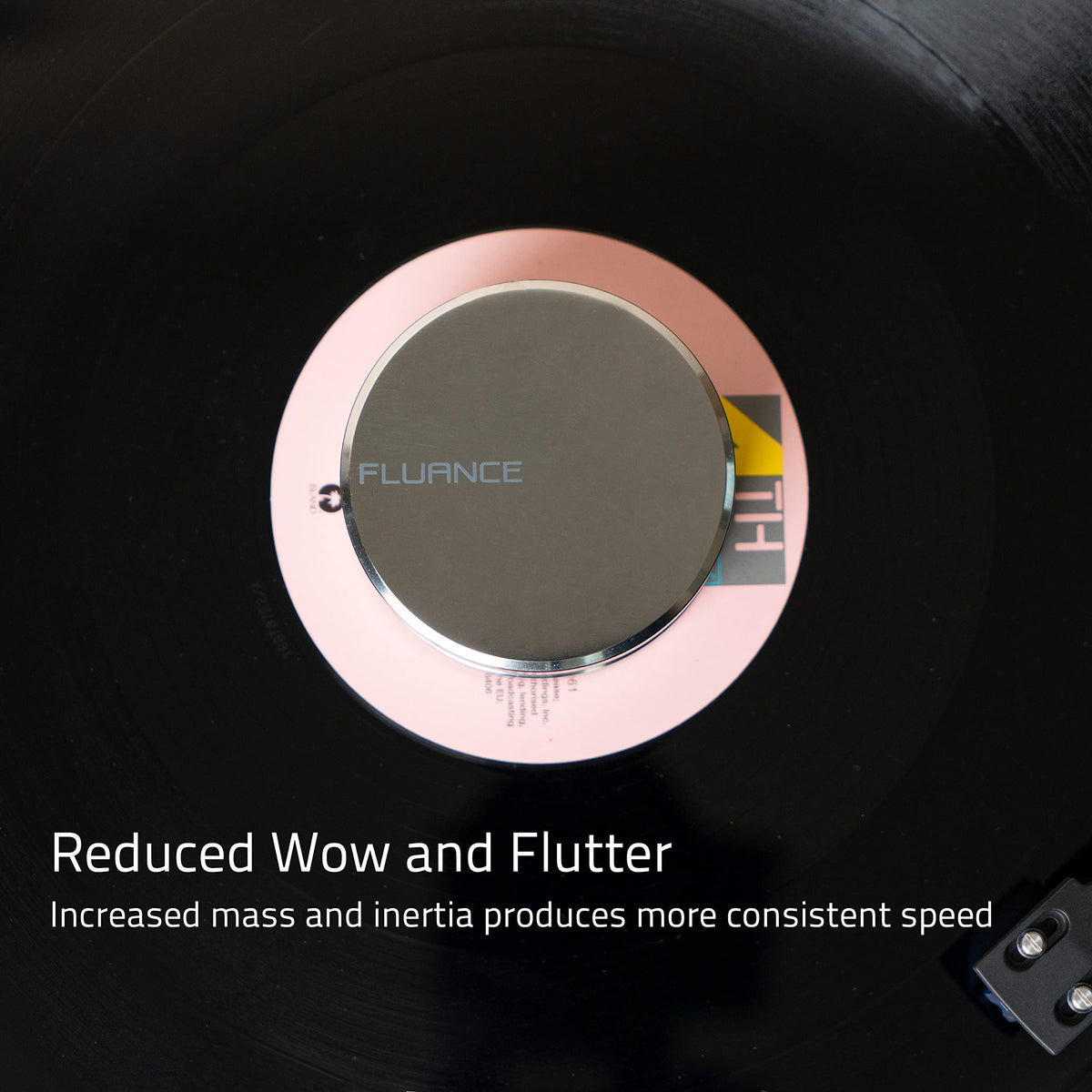 Fluance record weight in use on turntable improving contact and clarity