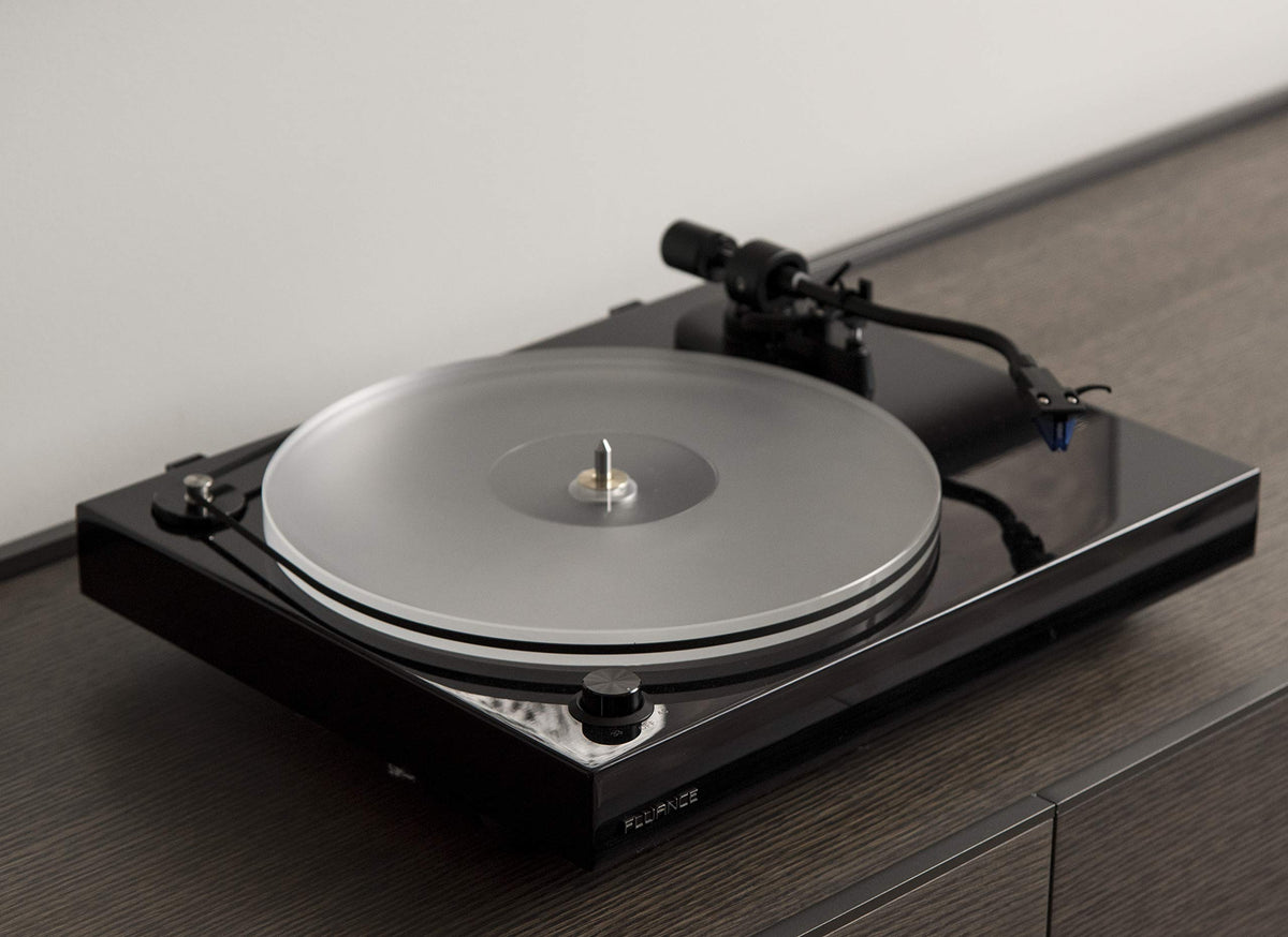 Fluance reference platter with brass spindle collar emphasizes flatness and durability.
