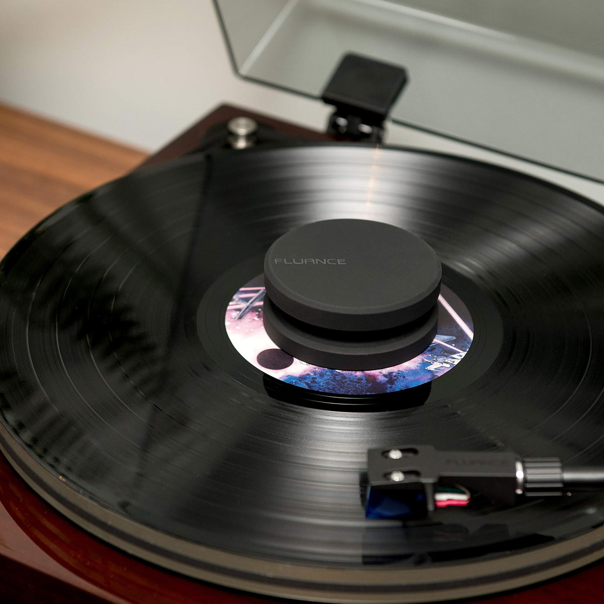 Fluance RW03 beside a vinyl sleeve showing scale and easy handling benefit