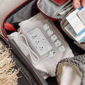 FONURXIZ next to passport for size comparison, clear luggage-friendly scale