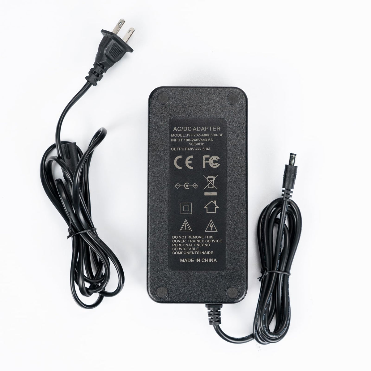 Fosi Audio compact power adapter placed in a home office setup