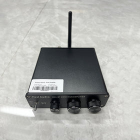 Fosi Audio M01-BT in a living room home theater setup enhancing movie bass