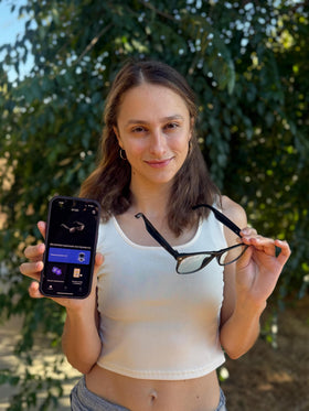 FREEZE2TRIM traveler wearing glasses using translation on the go for communication benefit