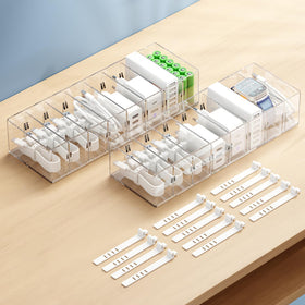 FRETONBA cable organizer box with 8 compartments keeps cords tidy in a drawer.