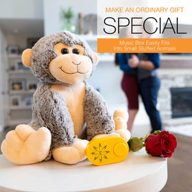 Friendly Songs lifestyle image of child listening to plush toy with comforting audio