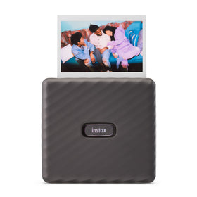 Fujifilm Instax Link Wide Mocha Gray printer on table ready to print memories.