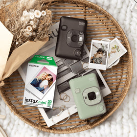 Fujifilm Instax Mini print next to a credit card to show compact instant photo size