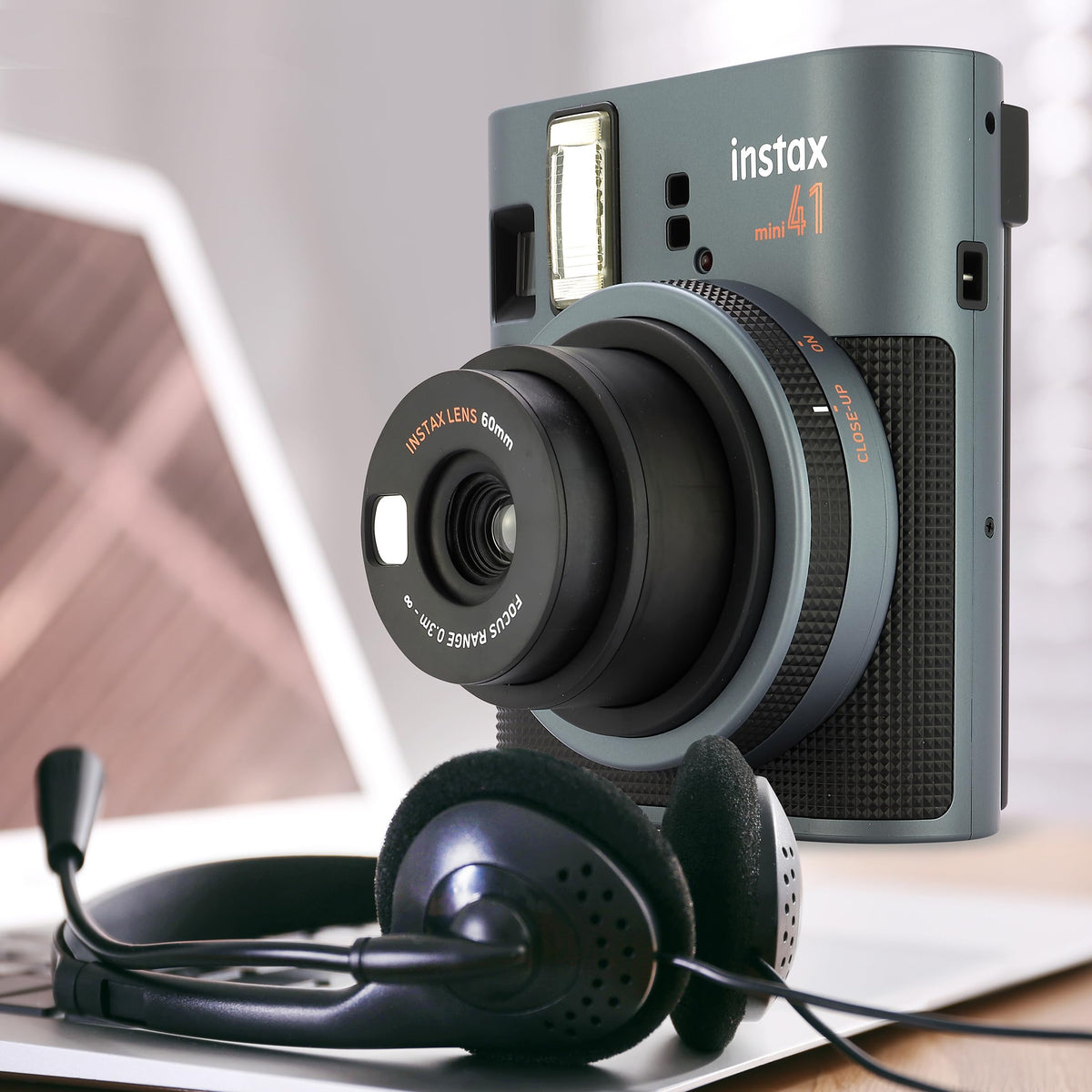 Fujifilm Instax Mini 41 microfiber cloth helps clean lenses and prints.