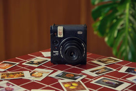 Fujifilm Instax Mini 99 bundle contents include film and accessories for instant memories.