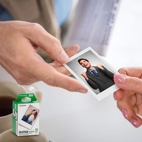Instant development as you shoot, with the photo sliding out for immediate viewing.