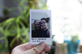 Fujifilm Instax Mini photo developing instantly for quick memories.