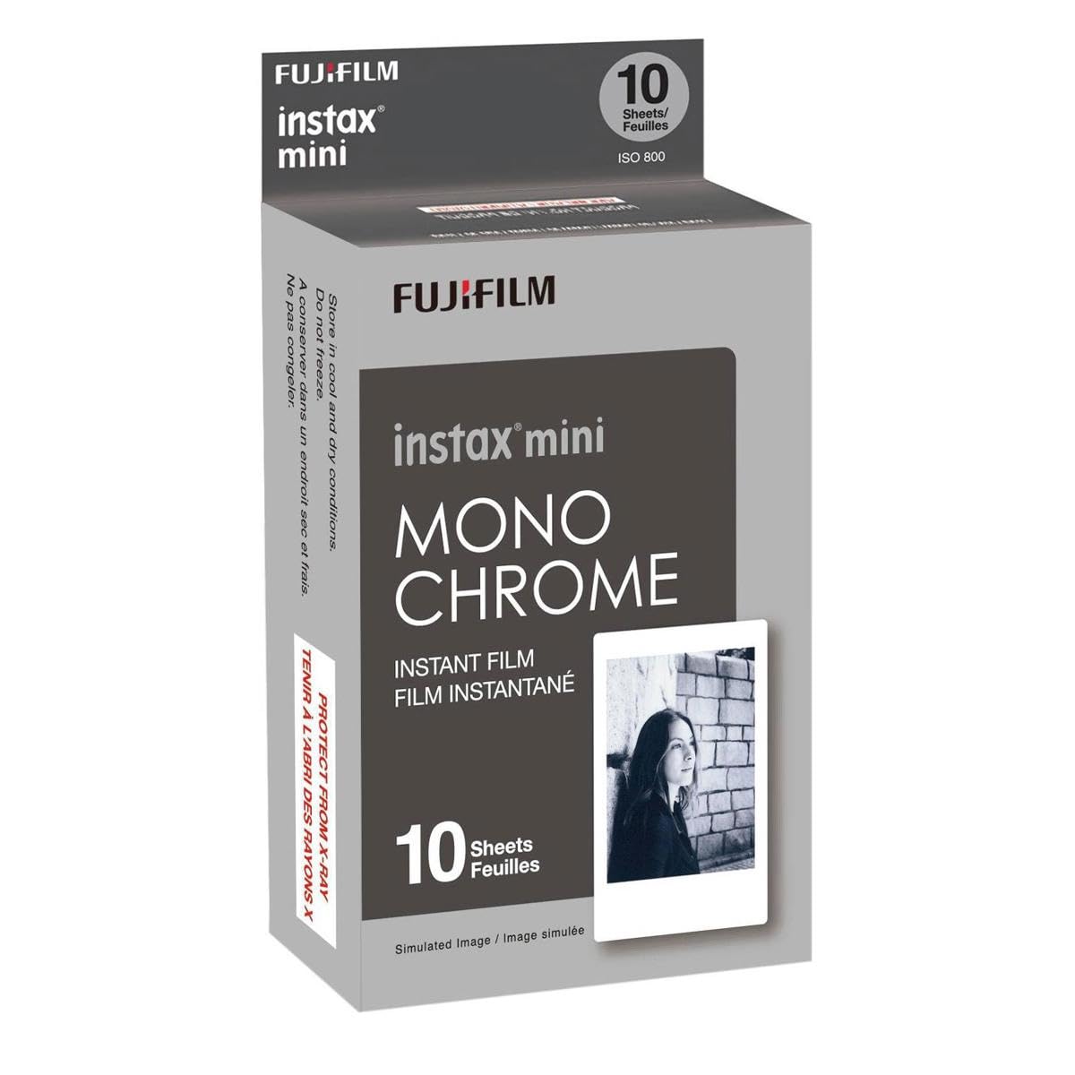 Fujifilm Instax Mini Monochrome printed photo beside a wallet demonstrating pocket-sized black-and-white prints