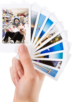 Fujifilm Instax prints pinned on bulletin board for easy home display