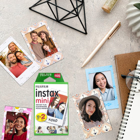 Fujifilm photo beside credit card showing Instax Mini print size for scale