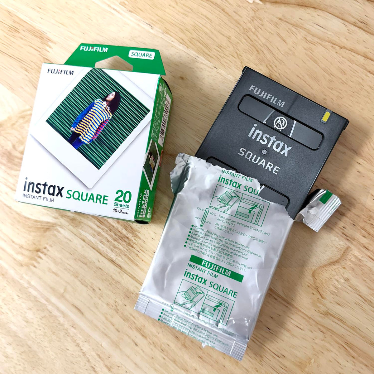 Fujifilm Instax Square film close-up shows bright tones for quick memories.