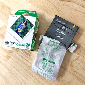 Fujifilm Instax Square film close-up shows bright tones for quick memories.