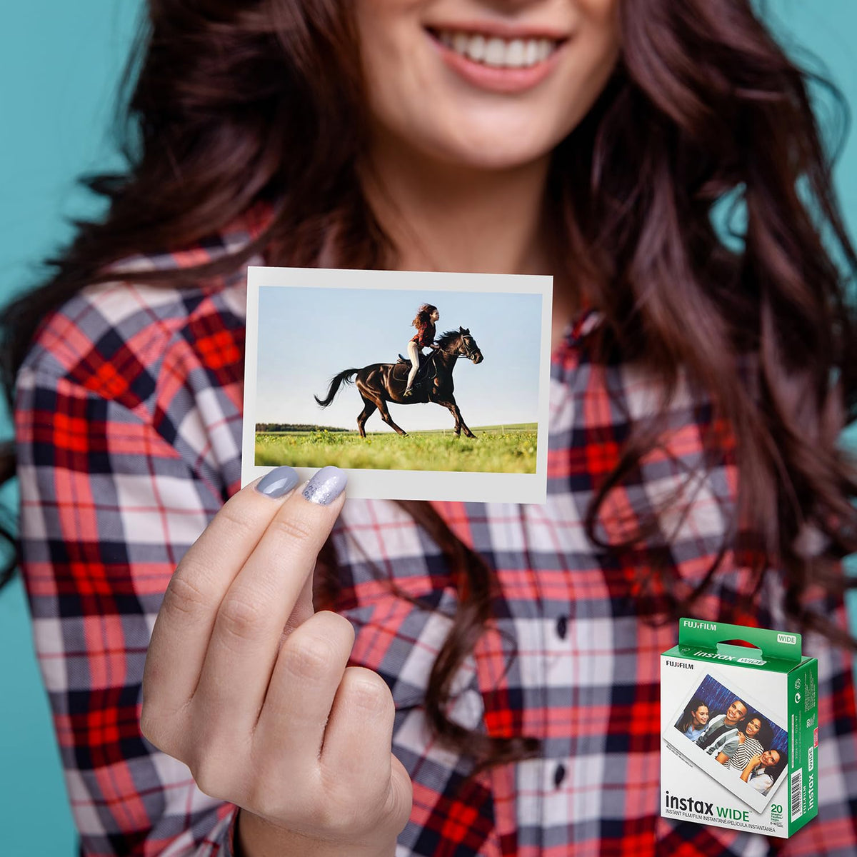 Fujifilm instax Wide camera in use capturing a group photo outdoors