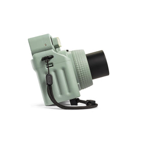 Fujifilm Instax Wide 400 Sage Green in-use shot showing a group photo setup.