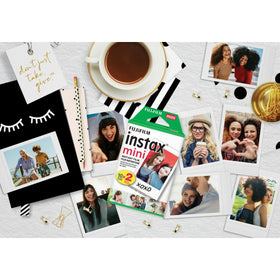 Fujifilm Mini instant photo emerging from camera showing on-moment development
