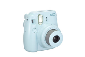 Instax Mini 8 Blue side view emphasizes slim profile and portable feel