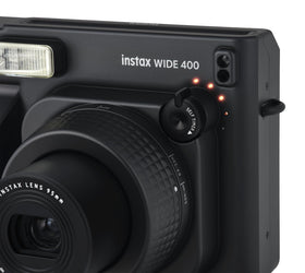 FUJIFILM Instax Wide 400 close-up lens attachment for dramatic macro detail.