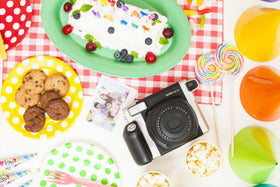 Fujifilm Instax Wide film immediate photo output with glossy finish and vibrant color.