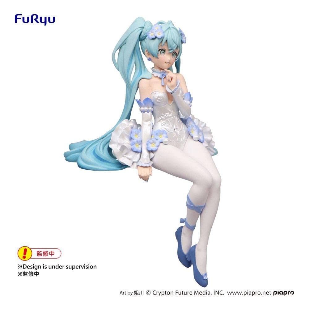 Furyu Hatsune Miku on a desk among books showing decorative presence and personality