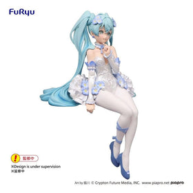 Furyu Hatsune Miku on a desk among books showing decorative presence and personality