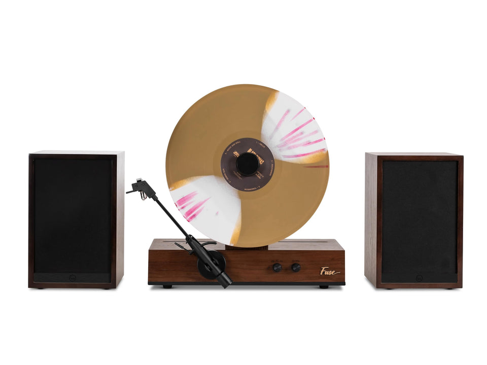 Fuse GLD vertical vinyl player with black trim serves as a striking living room centerpiece.