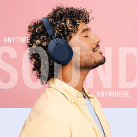 Gabba Goods blue headphones near FM radio feature for on-the-go listening