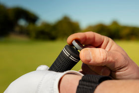 Garmin Approach CT1 pairing with a Garmin golf smartwatch for shot-by-shot data.