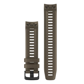 Garmin Instinct band on wrist in outdoor setting, coyote tan blends with gear for versatility