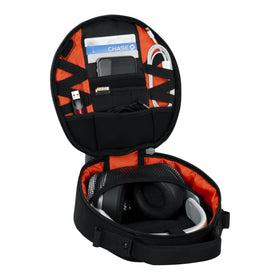 Gator G-CLUB next to headphones and phone showing compact, travel-ready scale