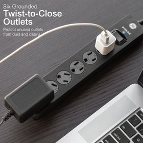 GE angled flat plug positioned behind furniture, saves space and keeps outlet free