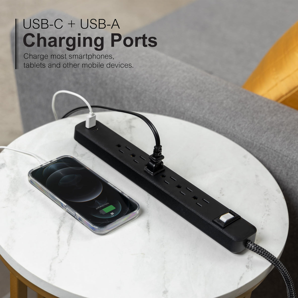 GE power strip in home office setup powering multiple devices safely.