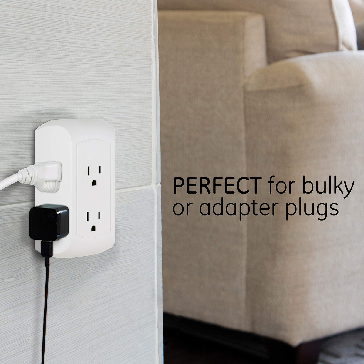 GE with bulky phone and laptop adapters plugged in showing extra-wide spacing benefit