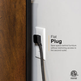 GE UltraPro flat plug tucked behind sofa demonstrating space-saving placement