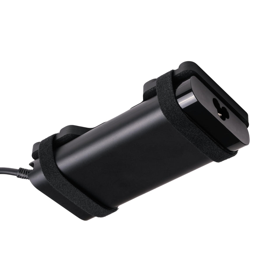 Generic front view of mounted laptop charger showing tidy desk benefit