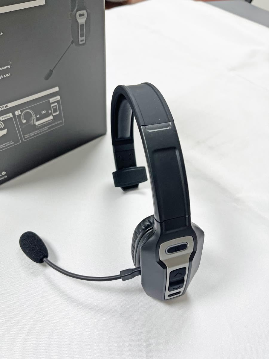 Generic headset on desk with laptop showing reliable office connectivity