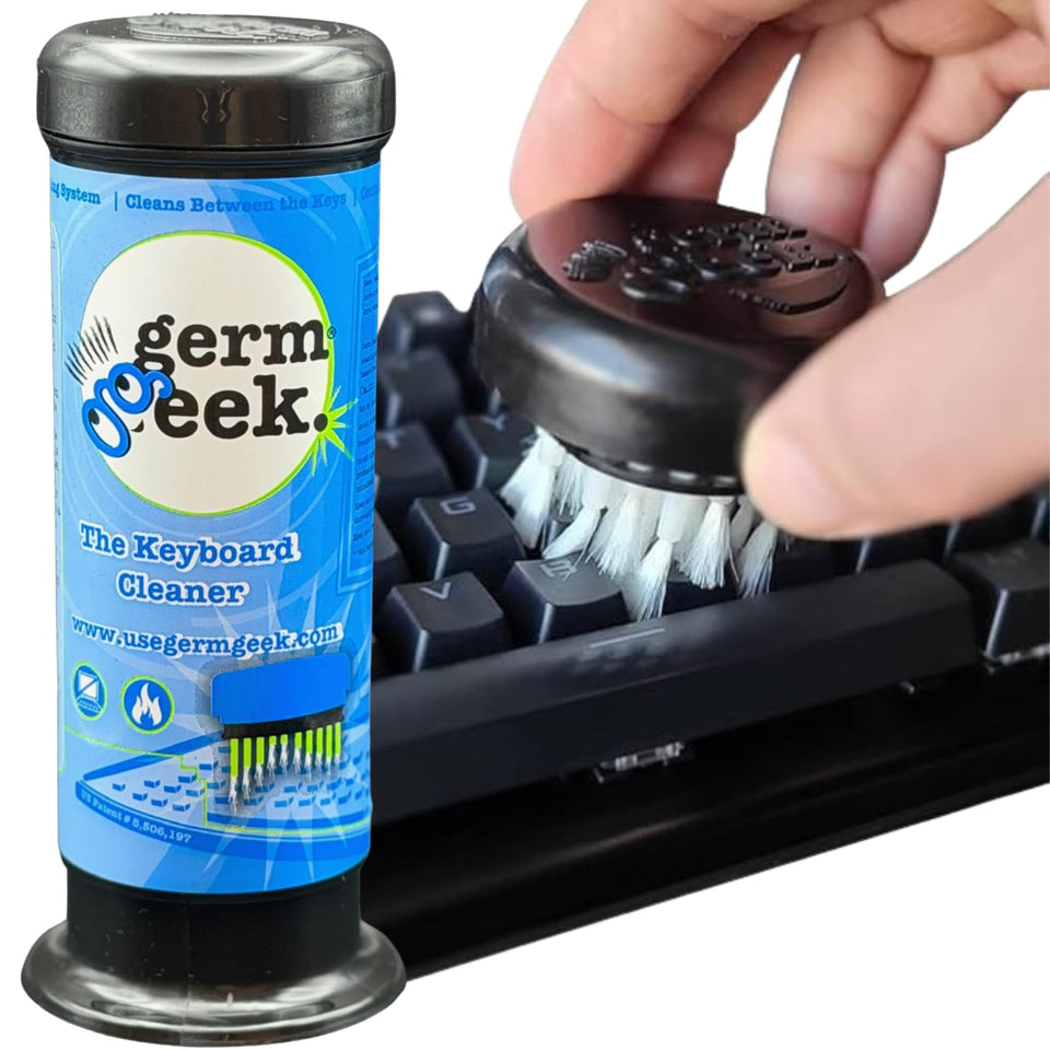 Germ Geek keyboard brush removing dust from keyboard crevices for a pristine feel