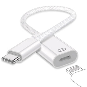 GetsISKON USB C to Lightning adapter on desk enabling versatile charging and audio use