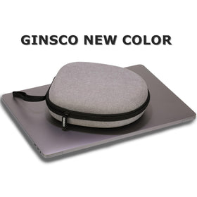 Ginsco case interior with elastic strap securing headphones for travel.