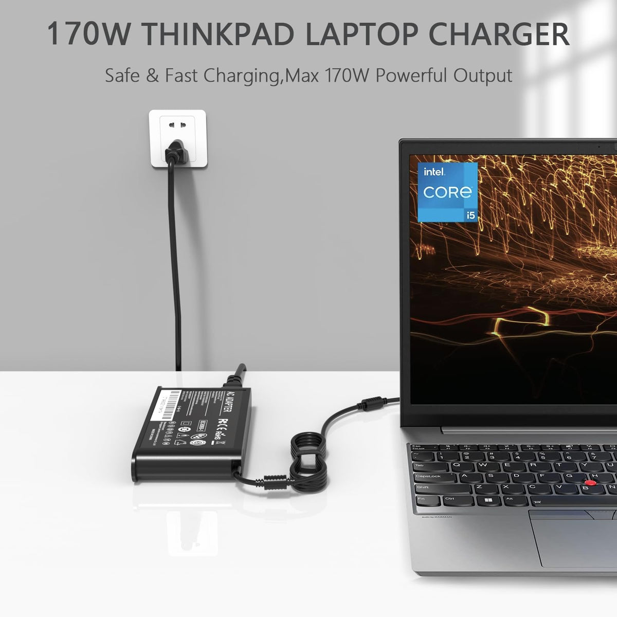 GKLSPL charger beside a laptop showing scale and travel-friendly size