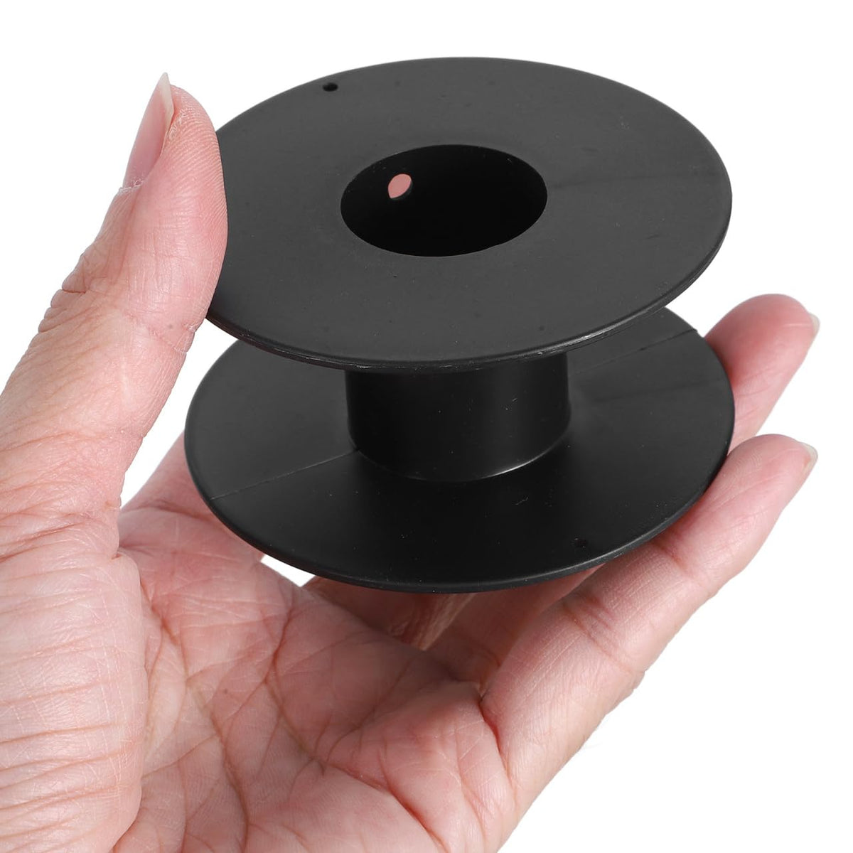 GLEAVI spool in hand to show size and portability for on-the-go projects