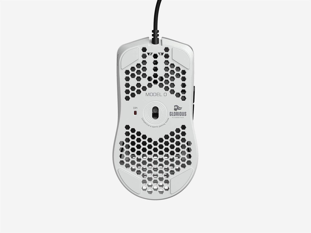 GLORIOUS Model O on gaming desk setup showing white aesthetic, coordinated look