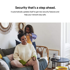 Google Nest Wifi Router next to phone for scale illustrating compact footprint benefit